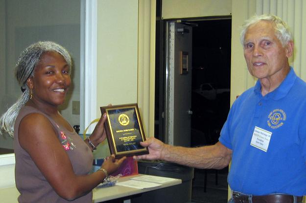 Rhonda Robb Baber receiving her plaque for 15 years of service